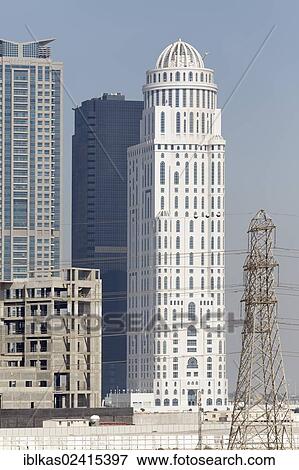 Skyscrapers and a discontinued construction site with the building shell, Jumeirah Lake Towers, Dubai, United Arab Emirates, Middle East, Asia View Large Photo Image Stock Photo - Skyscrapers and a discontinued construction site with the building shell, Jumeirah Lake Towers, Dubai, United Arab Emirates, Middle East, Asia. Fotosearch