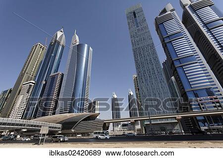 Skyscrapers and Metro Station Financial Centre, Sheikh Zayed Road, Dubai, United Arab Emirates, Middle East, Asia View Large Photo Image Stock Photo - Skyscrapers and Metro Station Financial Centre, Sheikh Zayed Road, Dubai, United Arab Emirates, Middle East, Asia. Fotosearch