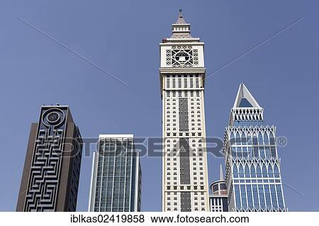 Skyscrapers built in differing architectural styles, Dubai International Financial Centre, DIFC, Dubai, United Arab Emirates, Middle East, Asia View Large Photo Image Stock Photo - Skyscrapers built in differing architectural styles, Dubai International Financial Centre, DIFC, Dubai, United Arab Emirates, Middle East, Asia. Fotosearch
