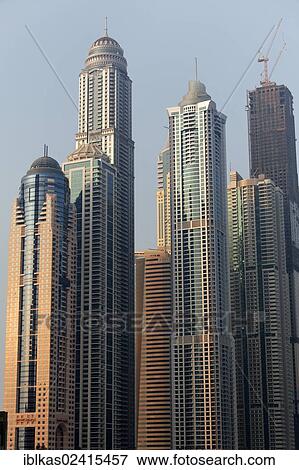Skyscrapers close together, Dubai Marina district, Dubai, United Arab Emirates, Middle East, Asia View Large Photo Image Stock Photo - Skyscrapers close together, Dubai Marina district, Dubai, United Arab Emirates, Middle East, Asia. Fotosearch