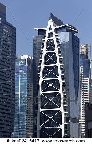 Skyscrapers, Indigo Icon building, large scale construction project, Jumeirah Lake Towers, Dubai, United Arab Emirates, Middle East, Asia View Large Photo Image Stock Photo - Skyscrapers, Indigo Icon building, large scale construction project, Jumeirah Lake Towers, Dubai, United Arab Emirates, Middle East, Asia. Fotosearch
