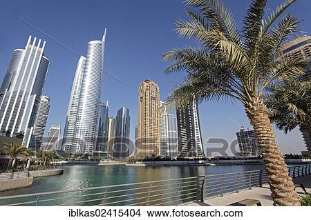 Skyscrapers on an artificial lake, large scale construction project, Jumeirah Lake Towers, Dubai, United Arab Emirates, Middle East, Asia View Large Photo Image Picture - Skyscrapers on an artificial lake, large scale construction project, Jumeirah Lake Towers, Dubai, United Arab Emirates, Middle East, Asia. Fotosearch