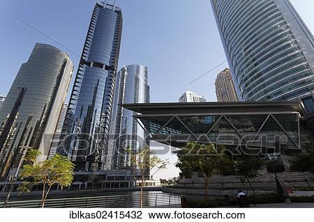 Skyscrapers on an artificial lake, Almas Tower, large scale construction project, Jumeirah Lake Towers, Dubai, United Arab Emirates, Middle East, Asia View Large Photo Image Stock Image - Skyscrapers on an artificial lake, Almas Tower, large scale construction project, Jumeirah Lake Towers, Dubai, United Arab Emirates, Middle East, Asia. Fotosearch
