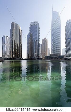 Skyscrapers on an artificial lake, large scale construction project, Jumeirah Lake Towers, Dubai, United Arab Emirates, Middle East, Asia View Large Photo Image Stock Photography - Skyscrapers on an artificial lake, large scale construction project, Jumeirah Lake Towers, Dubai, United Arab Emirates, Middle East, Asia. Fotosearch