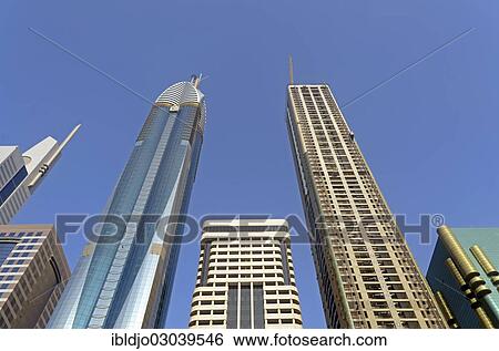 "Skyscrapers on Sheikh Zayed Road against a blue sky, Emirate of Dubai, United Arab Emirates, Asia" View Large Photo Image Stock Photograph - "Skyscrapers on Sheikh Zayed Road against a blue sky, Emirate of Dubai, United Arab Emirates, Asia". Fotosearch