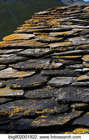 Stock Image - "Slate roof overgrown with lichens, house in the Averstal valley, canton of Grisons, Switzerland, Europe". Fotosearch