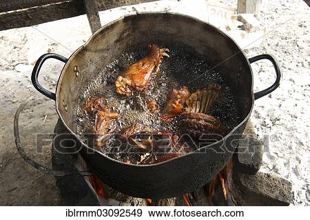 Stock Photo - "Slaughtered and dissected dogs being fried in hot oil, Siem Reap, Siem Reap, Siem Reap Province, Cambodia, Asia". Fotosearch