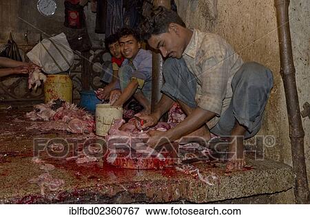 Stock Photo - "Slaughtering chicken at the chicken market in Kolkata, India, Asia". Fotosearch