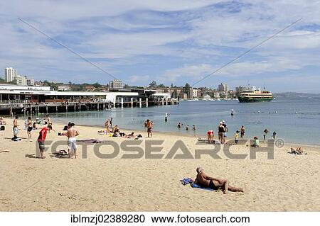 "Small beach at Manly Wharf, at back a ferry in the Manly Cove, North Sydney, New South Wales, NSW, Australia, Oceania" View Large Photo Image Stock Image - "Small beach at Manly Wharf, at back a ferry in the Manly Cove, North Sydney, New South Wales, NSW, Australia, Oceania". Fotosearch