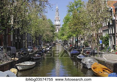 "Small boats along Groenburgwal canal, Zuiderkerk church at back, Amsterdam, province of North Holland, The Netherlands, Europe" View Large Photo Image Stock Photography - "Small boats along Groenburgwal canal, Zuiderkerk church at back, Amsterdam, province of North Holland, The Netherlands, Europe". Fotosearch