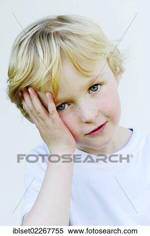 Small boy with his hand on his head View Large Photo Image Stock Photography - Small boy with his hand on his head. Fotosearch