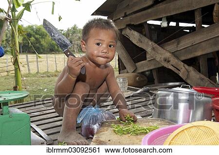 "Small child helping while cooking, Siem Reap, Siem Reap, Siem Reap Province, Cambodia, Asia" View Large Photo Image Stock Image - "Small child helping while cooking, Siem Reap, Siem Reap, Siem Reap Province, Cambodia, Asia". Fotosearch