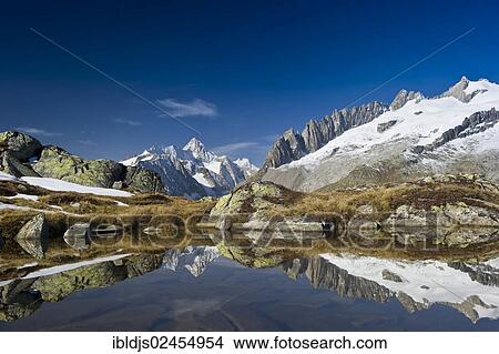 "Small lake above the Aletsch Glacier and the Bernese Oberland, UNESCO World Heritage Site, Bettmeralp, Valais, Switzerland, Europe" View Large Photo Image Picture - "Small lake above the Aletsch Glacier and the Bernese Oberland, UNESCO World Heritage Site, Bettmeralp, Valais, Switzerland, Europe". Fotosearch
