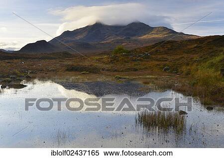 Stock Photography - "Small lake in front of the Black Cullins Mountains, Sligachan, Isle of Skye, Scotland, United Kingdom, Europe". Fotosearch
