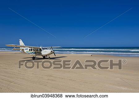 "Small plane landing on the 75 Mile Beach, Fraser Island, Queensland, Australia, Oceania" View Large Photo Image Stock Photo - "Small plane landing on the 75 Mile Beach, Fraser Island, Queensland, Australia, Oceania". Fotosearch