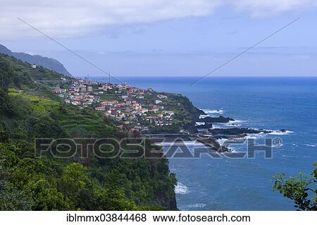 "Small village on a mountain side on the coast, Seixal, Madeira, Portugal, Europe" View Large Photo Image Stock Photo - "Small village on a mountain side on the coast, Seixal, Madeira, Portugal, Europe". Fotosearch