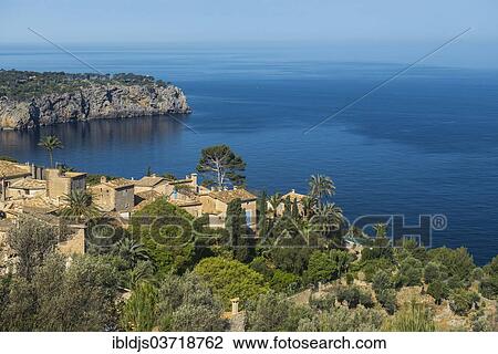 "Small village on the coast, Lluc Alcari, Deia, Majorca, Balearic Islands, Spain, Europe" View Large Photo Image Stock Image - "Small village on the coast, Lluc Alcari, Deia, Majorca, Balearic Islands, Spain, Europe". Fotosearch