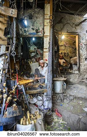 Stock Photo - "Small workplaces for smiths in the old city of Sana'a, UNESCO World Heritage Site, Sana'a, Yemen, Asia". Fotosearch