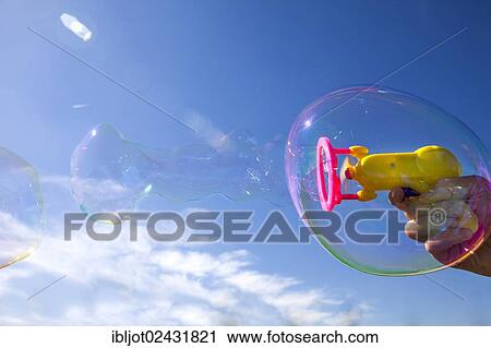 Smaller soap bubbles enclosed in larger bubbles from a bubble machine View Large Photo Image Stock Image - Smaller soap bubbles enclosed in larger bubbles from a bubble machine. Fotosearch