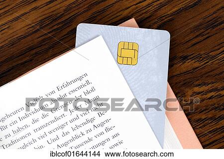 "Smart card between the pages of a book, symbolic image for an educational smart card" View Large Photo Image Picture - "Smart card between the pages of a book, symbolic image for an educational smart card". Fotosearch