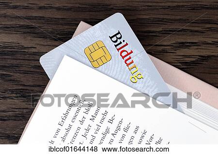 Stock Photo - "Smart card with the word Bildung, German for education, between the pages of a book, symbolic image for an educational smart card". Fotosearch