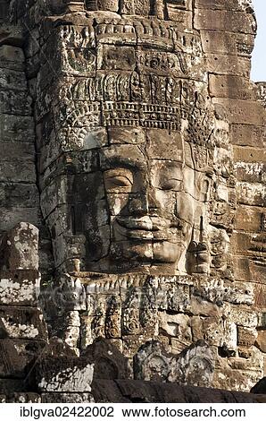 Stock Image - Smile of Angkor, huge face carved in stone on a tower, Bayon Temple, Angkor Thom, Siem Reap, Cambodia, Southeast Asia, Asia. Fotosearch