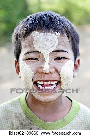 "Smiling boy wearing thanaka paste on his face, Bagan, Myanmar, Burma, Southeast Asia, Asia" View Large Photo Image Stock Image - "Smiling boy wearing thanaka paste on his face, Bagan, Myanmar, Burma, Southeast Asia, Asia". Fotosearch
