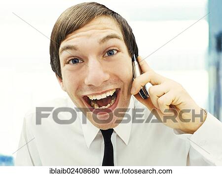 Smiling businessman with a happy face speaking on this mobile phone View Large Photo Image Stock Image - Smiling businessman with a happy face speaking on this mobile phone. Fotosearch