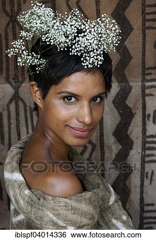 Smiling dark-skinned woman with flowers on her head View Large Photo Image Stock Photograph - Smiling dark-skinned woman with flowers on her head. Fotosearch