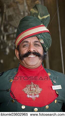 Stock Photography - "Smiling doorman, portrait, Palace Hotel, Umaid Bhawan Palace, Jodhpur, Rajasthan, India, Asia". Fotosearch