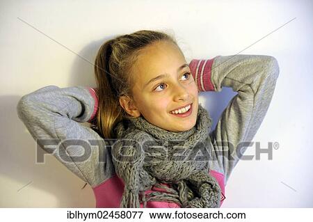 "Smiling girl, 10 years old, holding her arms behind her head" View Large Photo Image Stock Photo - "Smiling girl, 10 years old, holding her arms behind her head". Fotosearch
