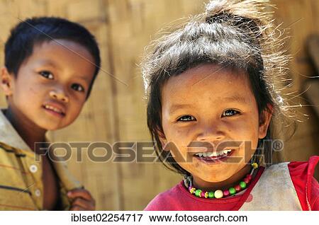 "Smiling girl and a boy in Laos, Southeast Asia, Asia" View Large Photo Image Stock Photo - "Smiling girl and a boy in Laos, Southeast Asia, Asia". Fotosearch