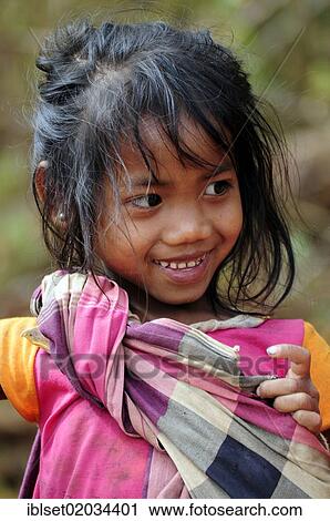 Stock Image - "Smiling girl in Laos, Southeast Asia, Asia". Fotosearch