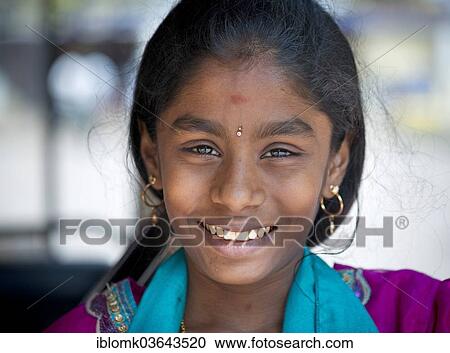 Stock Image - "Smiling girl, portrait, Meenakshi Amman Temple or Sri Meenakshi Sundareswarar Temple, Madurai, Tamil Nadu, India, Asia". Fotosearch