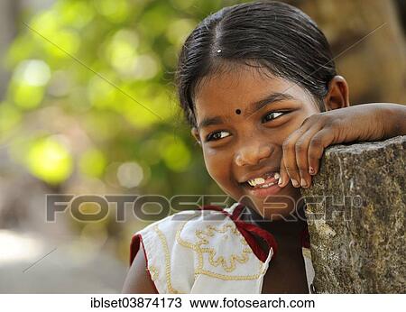Stock Image - "Smiling girl with a bindi, Kerala, South India, India, Asia". Fotosearch