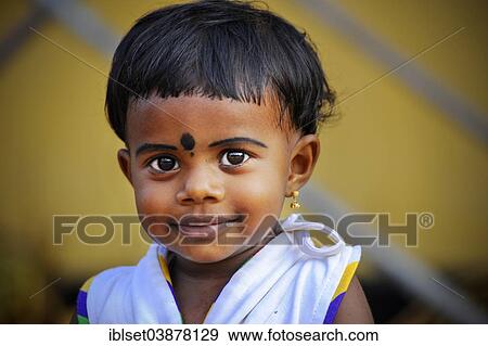 Stock Photo - "Smiling girl with a bindi, Kerala, South India, India, Asia". Fotosearch