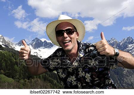 "Smiling man wearing a straw hat, sunglasses, thumbs up, in the Tyrolean mountains, Kaunertal, Tyrol, Austria, Europe" View Large Photo Image Stock Image - "Smiling man wearing a straw hat, sunglasses, thumbs up, in the Tyrolean mountains, Kaunertal, Tyrol, Austria, Europe". Fotosearch