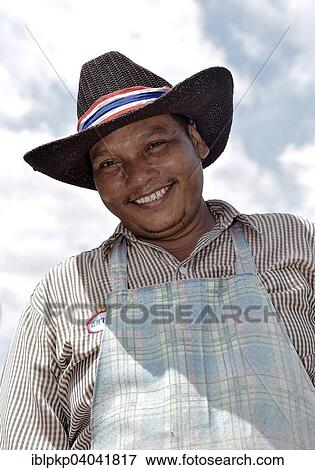 "Smiling man with a hat and an apron, Hua Hin, Thailand, Asia" View Large Photo Image Stock Photo - "Smiling man with a hat and an apron, Hua Hin, Thailand, Asia". Fotosearch
