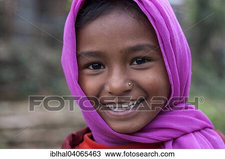 Stock Image - "Smiling Nepalese girl with purple headscarf, portrait, Bandipur, Nepal, Asia". Fotosearch
