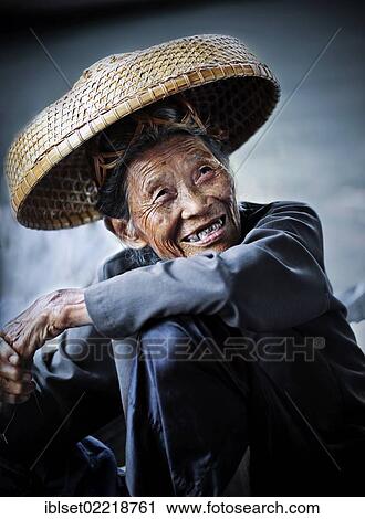 "Smiling old woman wearing a straw hat at the floating market, Damnoen Saduak, Thailand, Southeast Asia, Asia" View Large Photo Image Stock Image - "Smiling old woman wearing a straw hat at the floating market, Damnoen Saduak, Thailand, Southeast Asia, Asia". Fotosearch