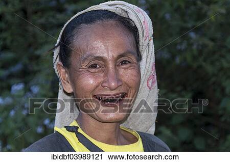 "Smiling woman from the Lahu people, hill tribe, ethnic minority, with blackened teeth from chewing betel nuts, portrait, Mae Hong Song Province, Northern Thailand, Thailand, Asia" View Large Photo Image Stock Image - "Smiling woman from the Lahu people, hill tribe, ethnic minority, with blackened teeth from chewing betel nuts, portrait, Mae Hong Song Province, Northern Thailand, Thailand, Asia". Fotosearch
