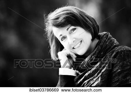 "Smiling woman outdoors, portrait" View Large Photo Image Stock Photo - "Smiling woman outdoors, portrait". Fotosearch