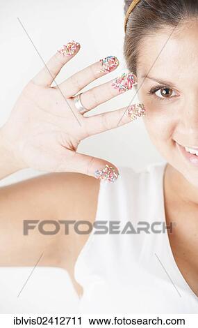 Smiling woman with colorful sprinkles on her hand View Large Photo Image Stock Image - Smiling woman with colorful sprinkles on her hand. Fotosearch