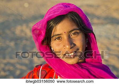 "Smiling young woman with a headscarf and a bindi on her forehead, portrait, Pushkar, Rajasthan, India, Asia" View Large Photo Image Stock Image - "Smiling young woman with a headscarf and a bindi on her forehead, portrait, Pushkar, Rajasthan, India, Asia". Fotosearch