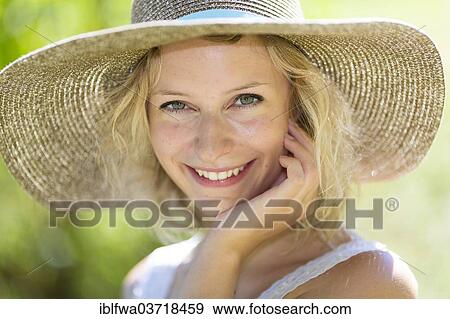 "Smiling young woman with summer hat, Waidhofen an der Ybbs, Lower Austria, Austria, Europe" View Large Photo Image Stock Photo - "Smiling young woman with summer hat, Waidhofen an der Ybbs, Lower Austria, Austria, Europe". Fotosearch