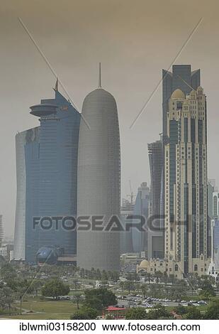 "Smog over Corniche waterfront promenade with the skyline of Doha with Al Bidda Tower, World Trade Center, Palm Tower 1 and 2, Burj Qatar Tower, Doha, Doha, Qatar, Asia" View Large Photo Image Stock Image - "Smog over Corniche waterfront promenade with the skyline of Doha with Al Bidda Tower, World Trade Center, Palm Tower 1 and 2, Burj Qatar Tower, Doha, Doha, Qatar, Asia". Fotosearch