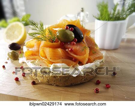 Smoked salmon and cream cheese on a bagel View Large Photo Image Picture - Smoked salmon and cream cheese on a bagel. Fotosearch