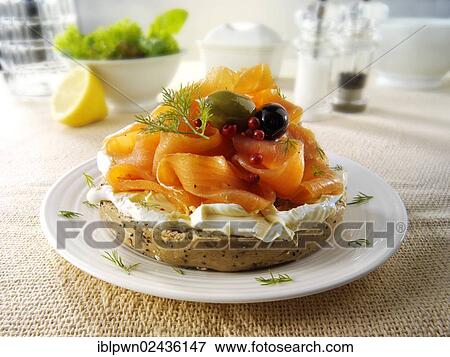 Smoked salmon and cream cheese on a bagel View Large Photo Image Stock Photo - Smoked salmon and cream cheese on a bagel. Fotosearch