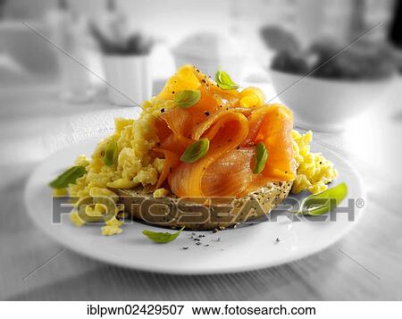 Smoked salmon and scrambled eggs bagel View Large Photo Image Stock Photo - Smoked salmon and scrambled eggs bagel. Fotosearch