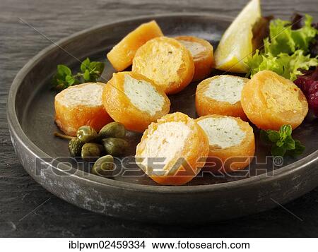 Smoked salmon rolls filled with cream cheese and cream cheese and peppers View Large Photo Image Picture - Smoked salmon rolls filled with cream cheese and cream cheese and peppers. Fotosearch